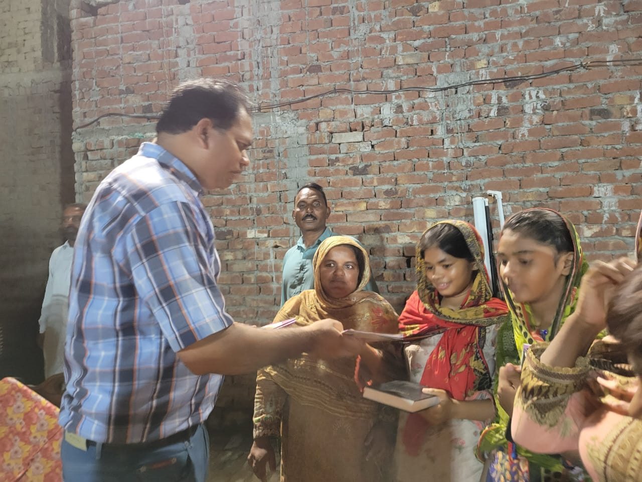 A volunteer sharing resources with children and families