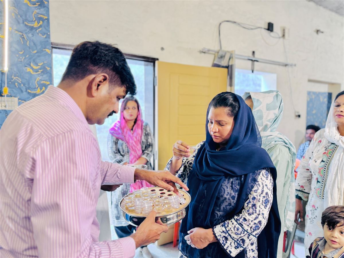 A woman receiving communion during a service