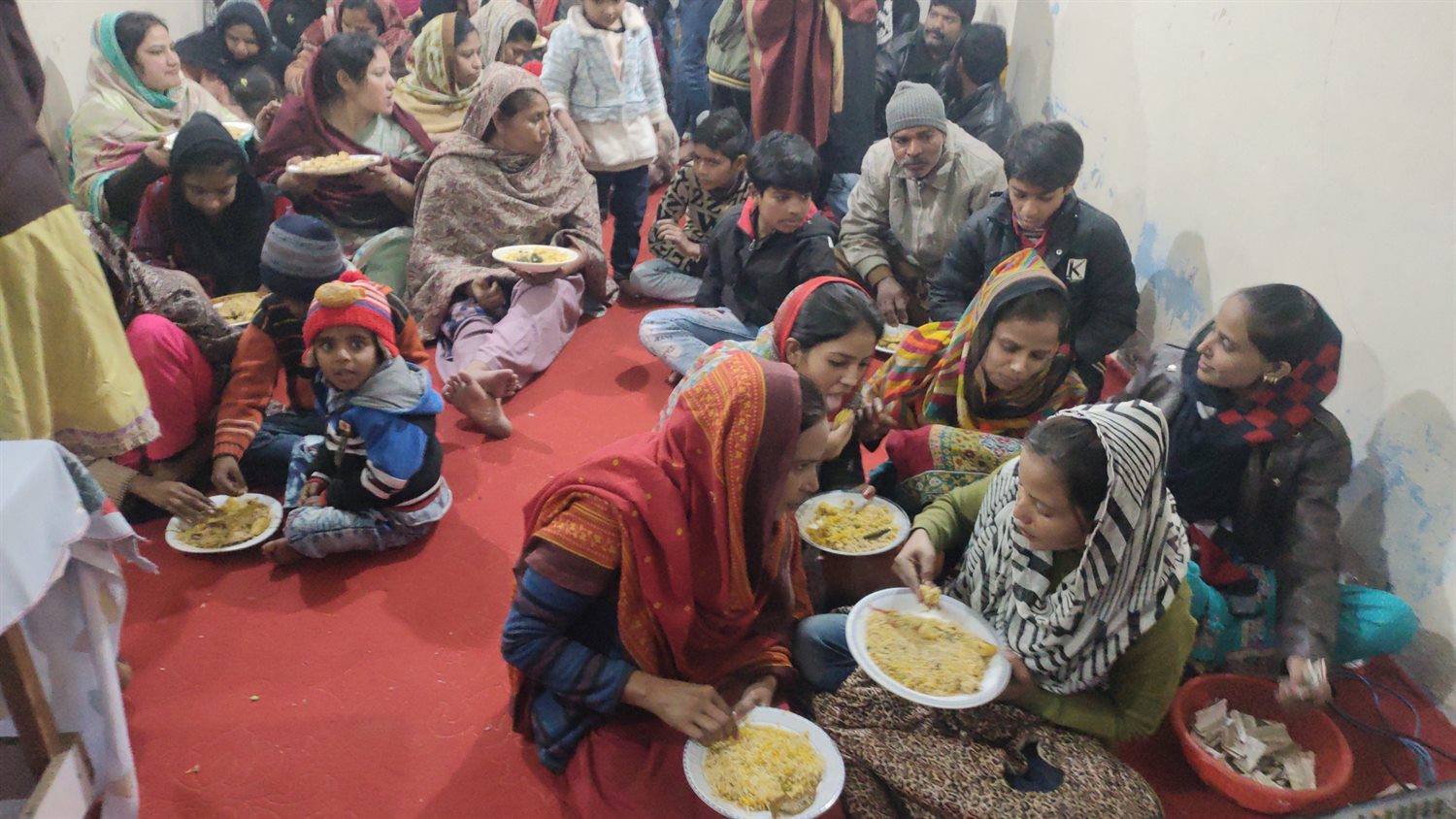 People seated together during a community meal
