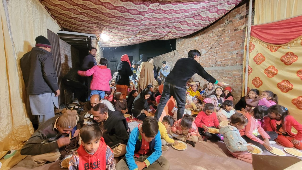 A community receiving food during an outreach visit