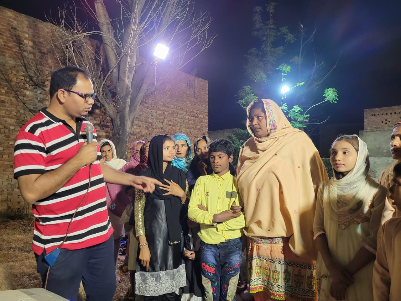 A ministry team praying with community members