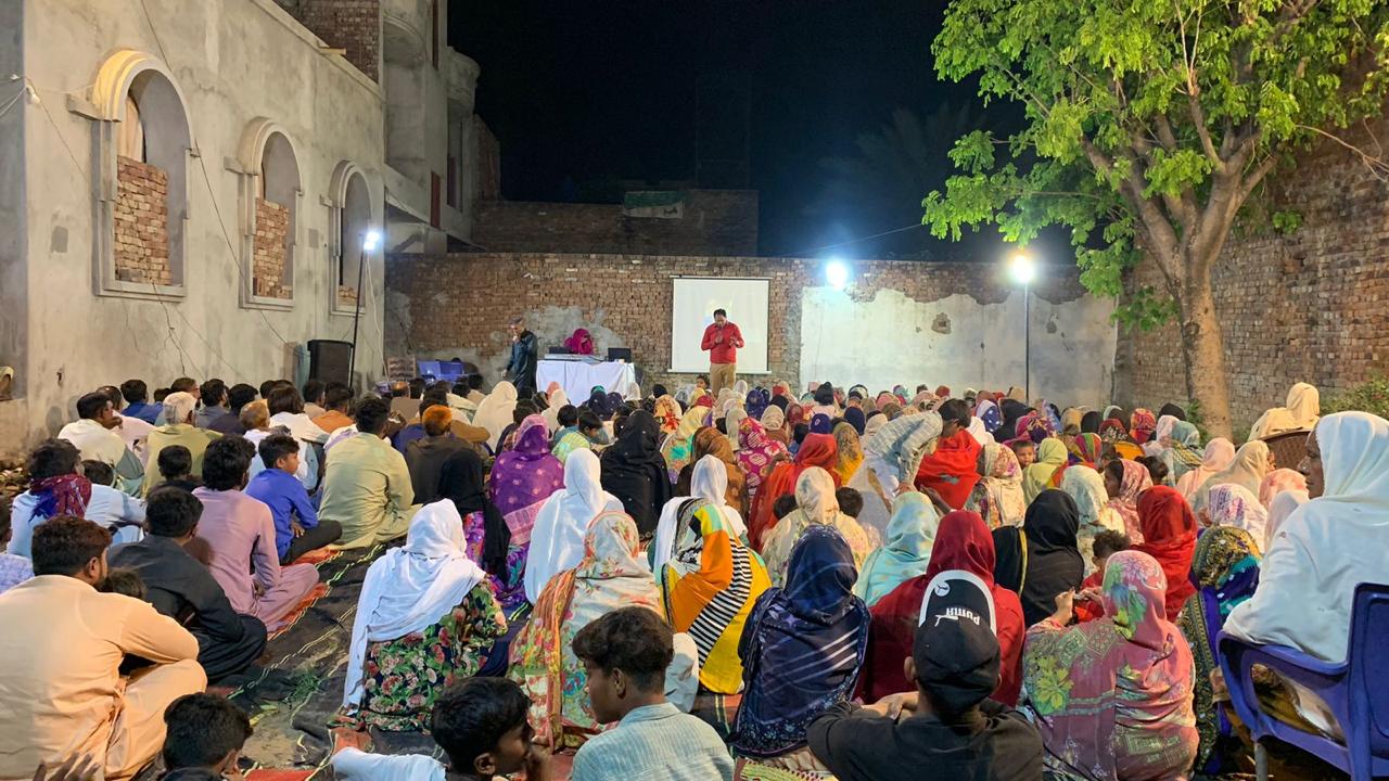 Community members gathered at an outdoor ministry meeting